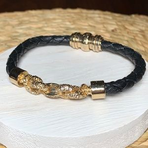 Black Woven Leather bracelet, with Gold and Crystal Links. Approximately 7”